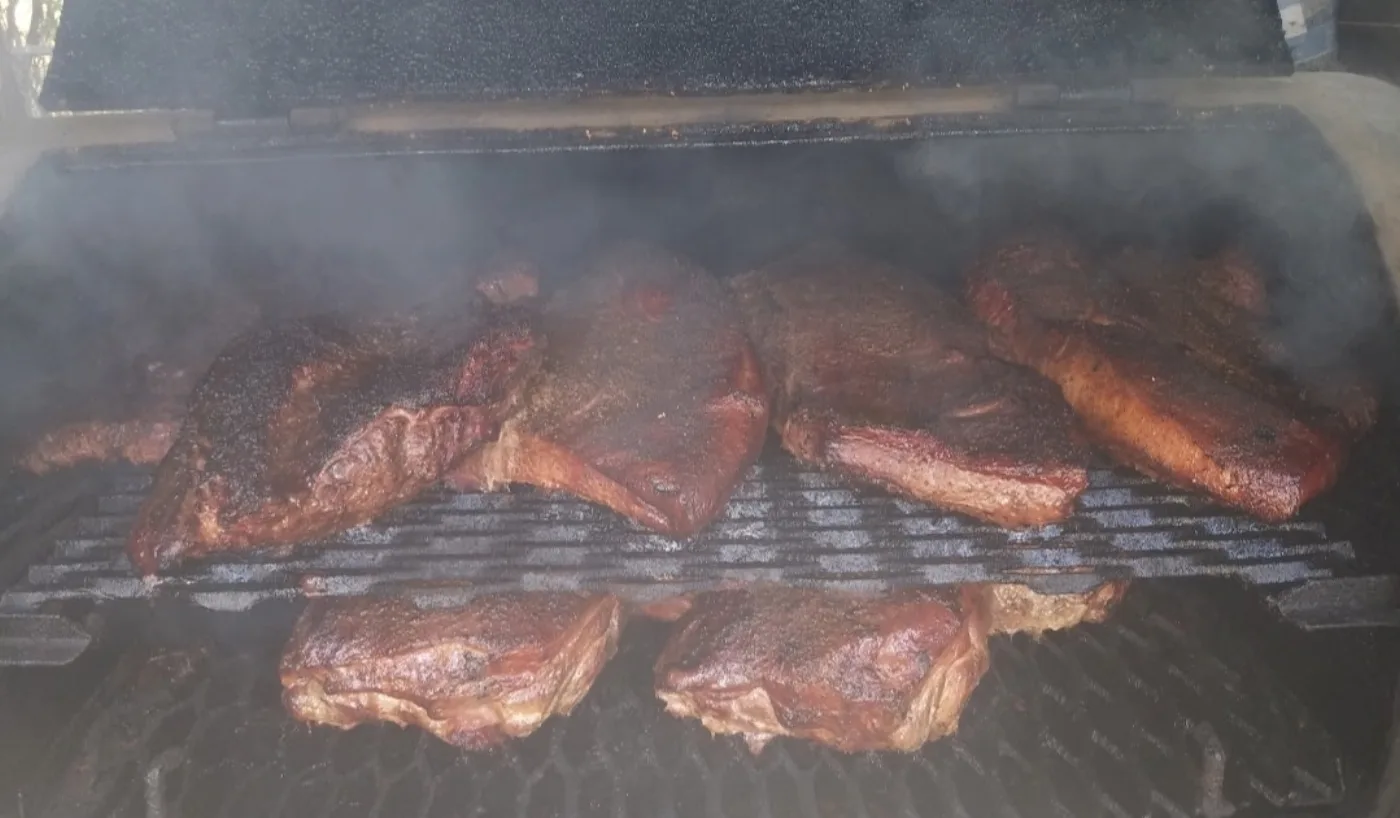 Brisket smoking low and slow on the pit